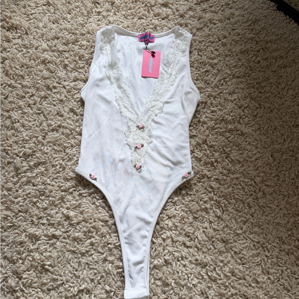 White Lace Trim bodysuit w/ rose embellishment’s
